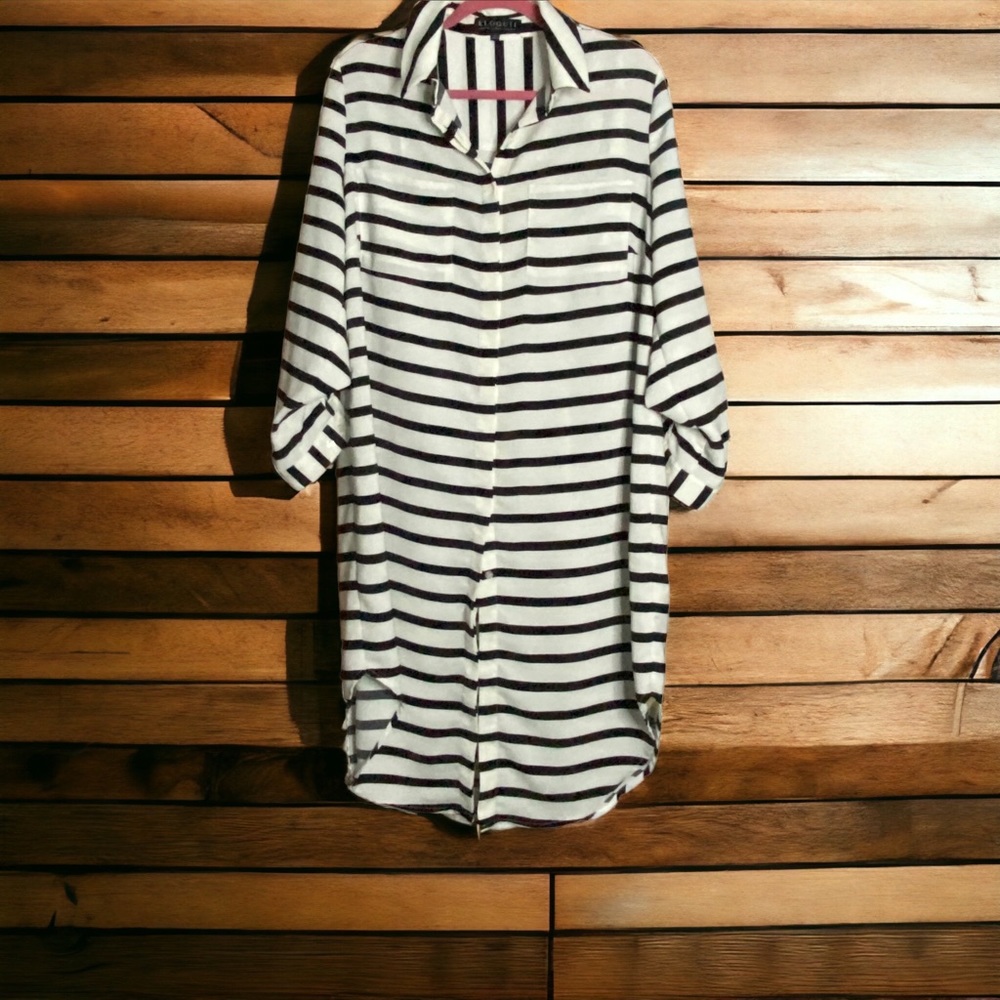 Eloquii Size 14 black and white striped shirtdress with curved hem.
